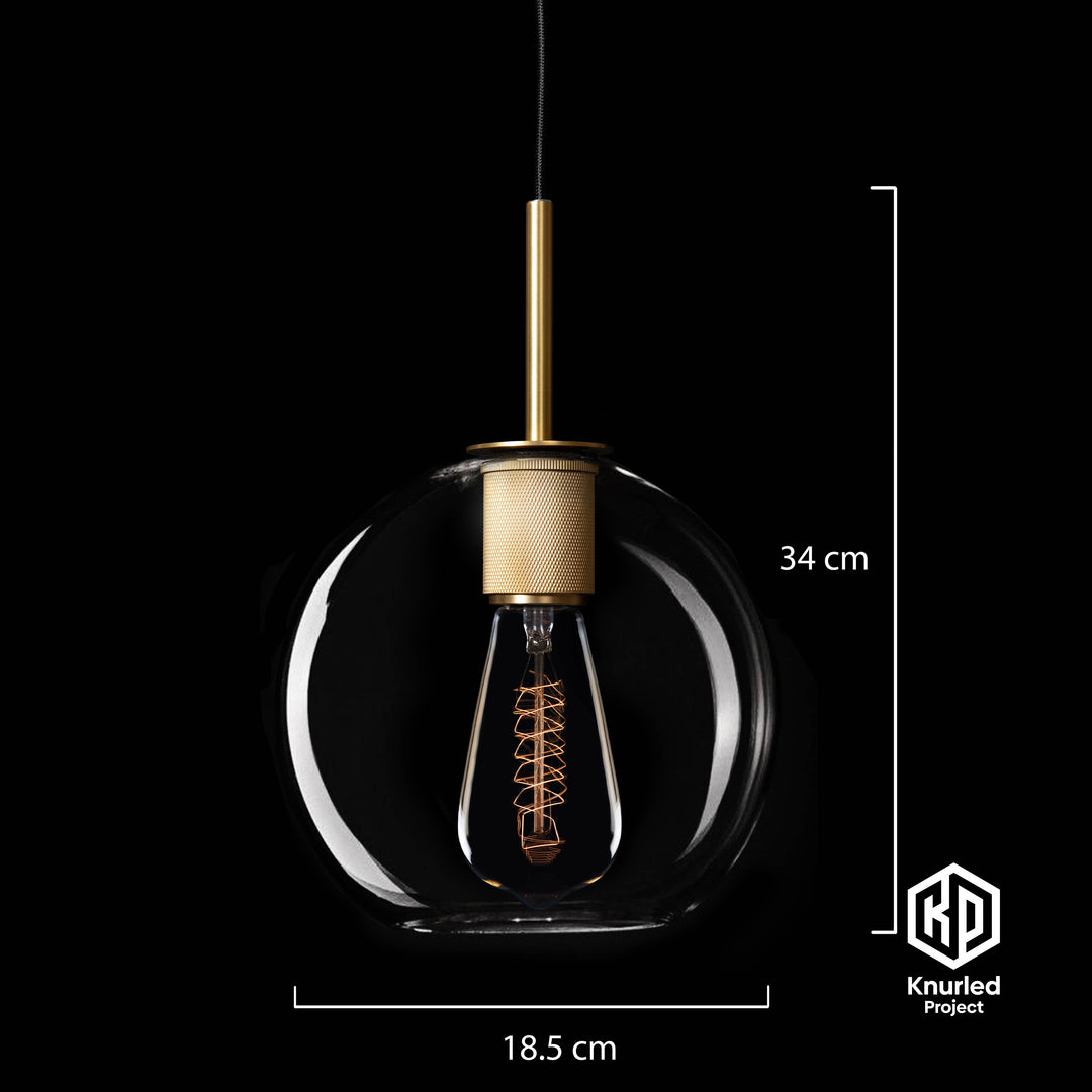 Brass pendant light with a globe shape light shade hanging from light chord on a black background with product measurements