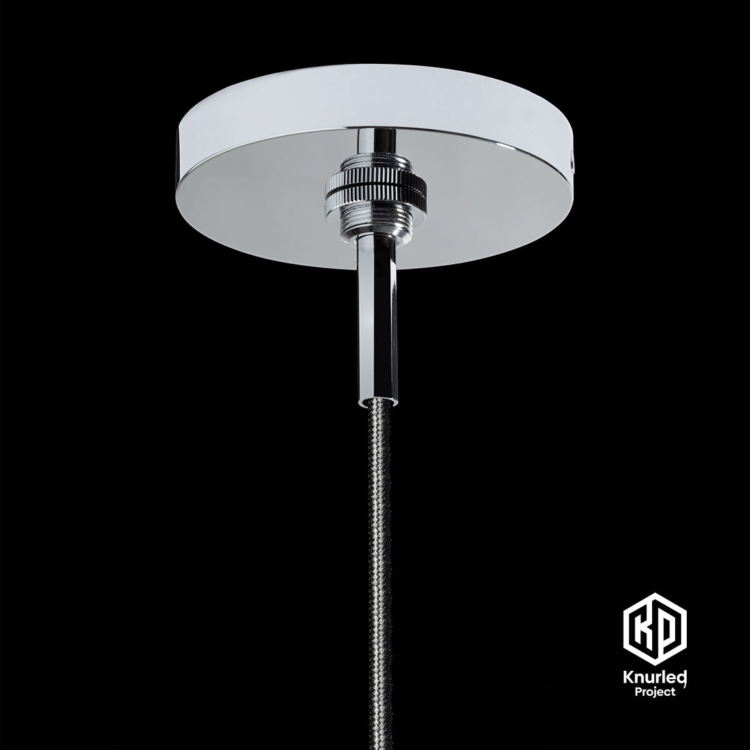 Chrome pendant light base on a black background