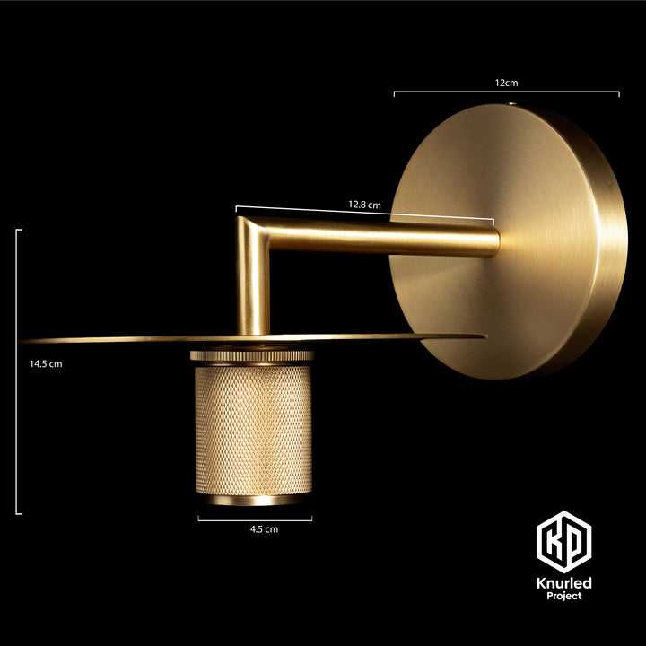 Brass wall light at an angle on a black background with product measurements