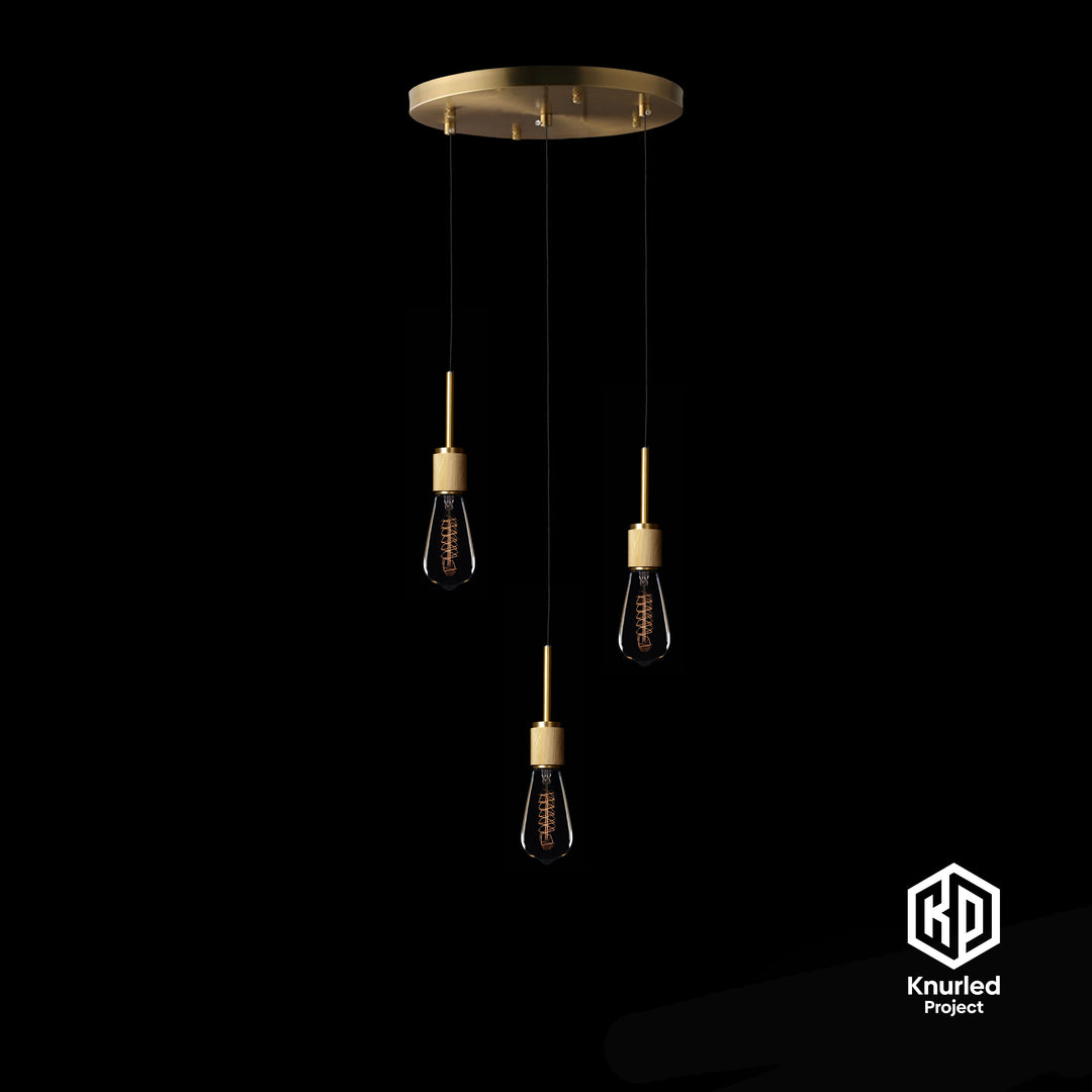 A brass chandelier with three pendant lights