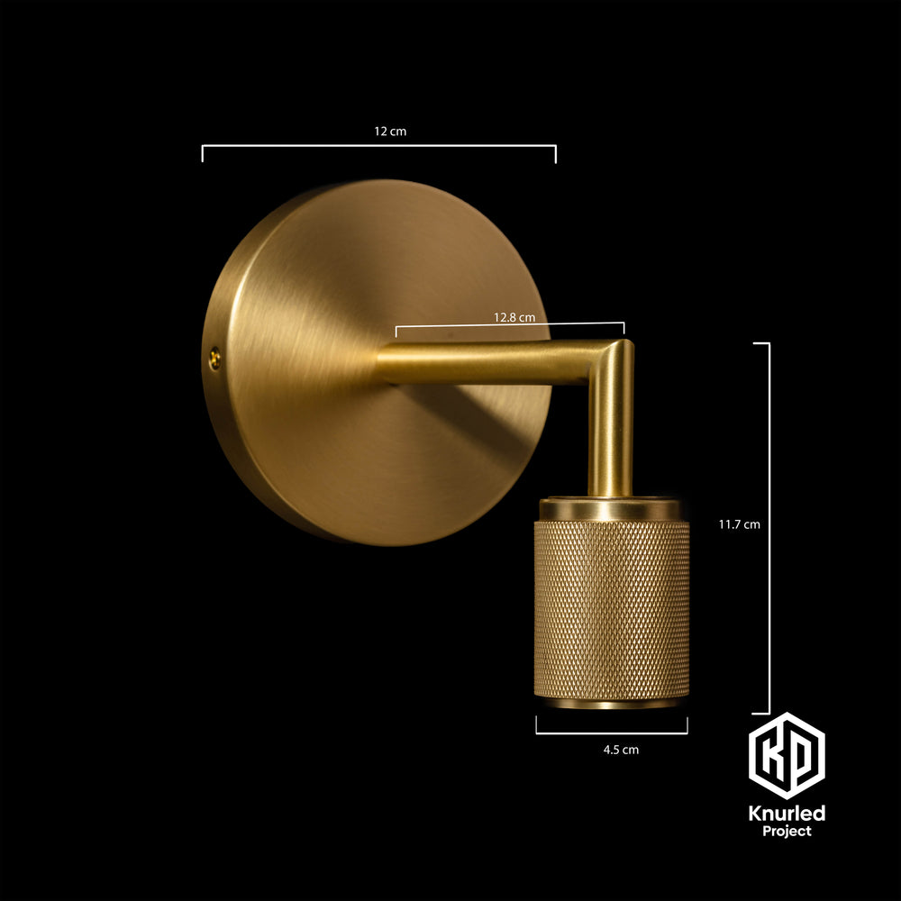 Brass wall light at an angle with product measurements  on a black background