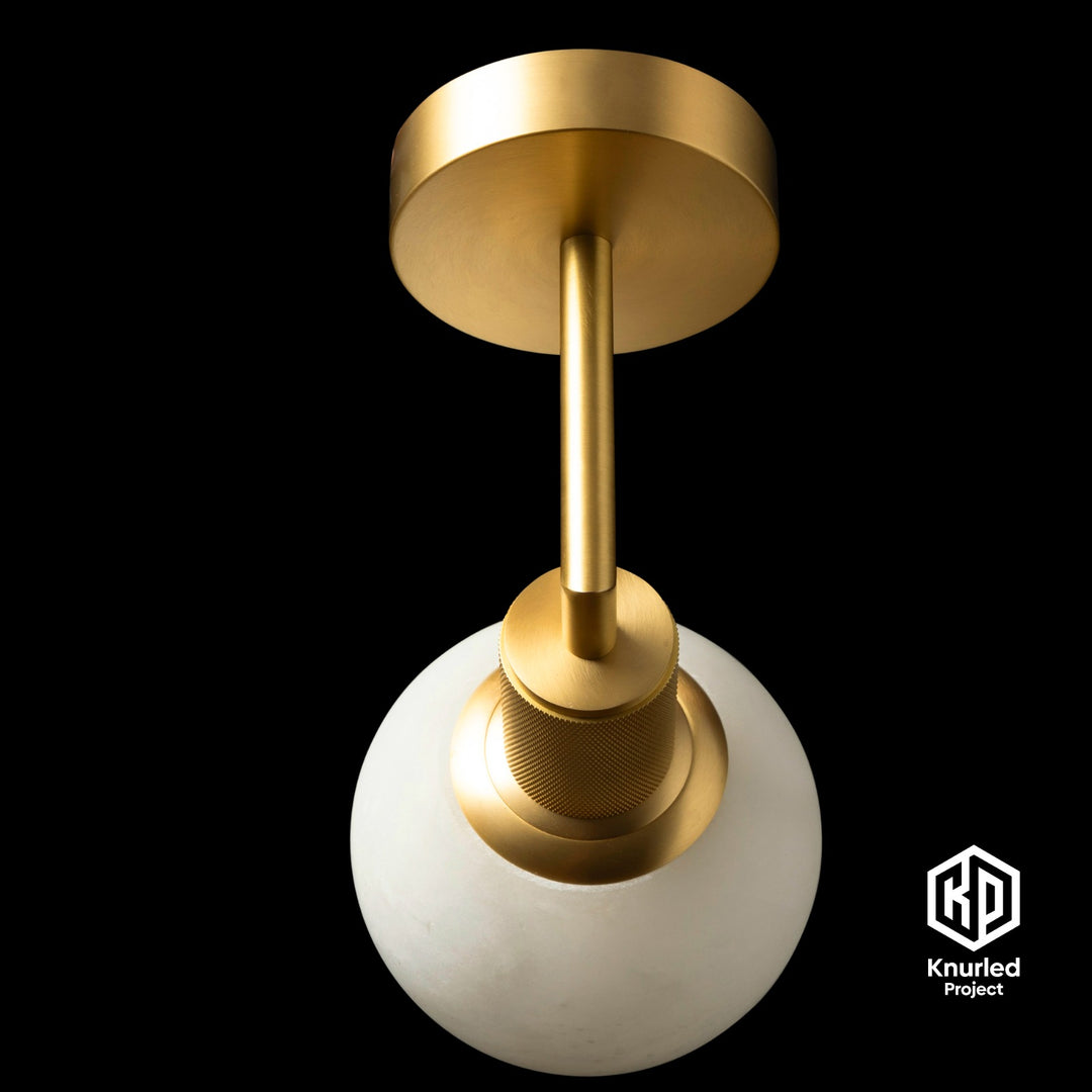 birdseye view marble globe brass wall light