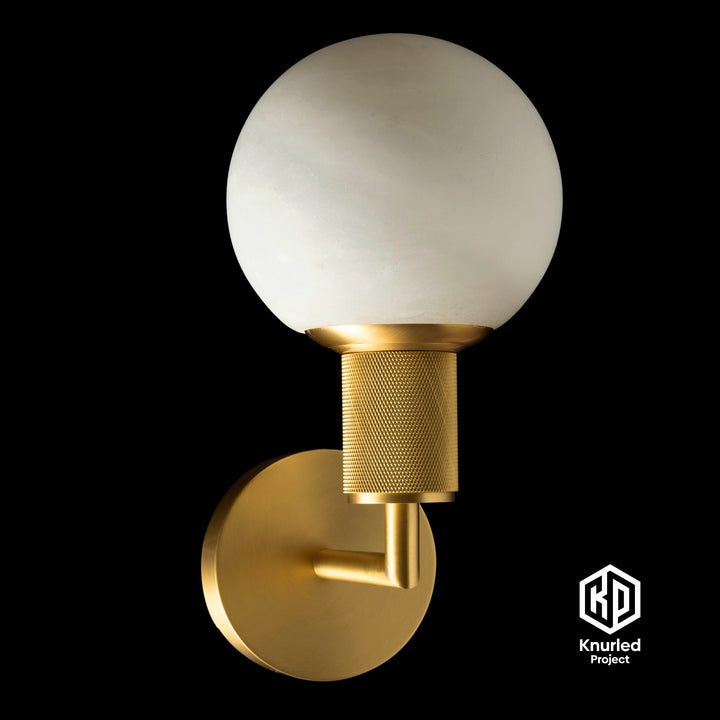 Marble brass sconce light on black background