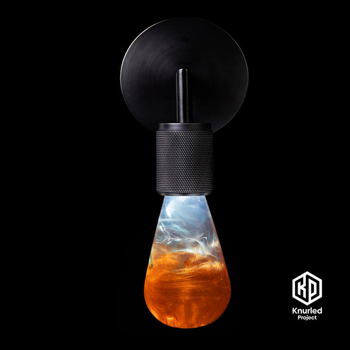 Orange lava mood bulb in a matte black wall light