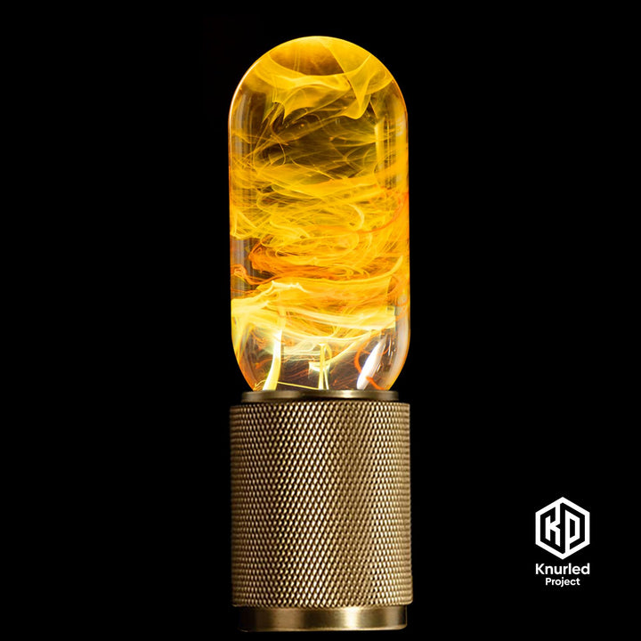 Yellow lava mood bulb in a brass holder